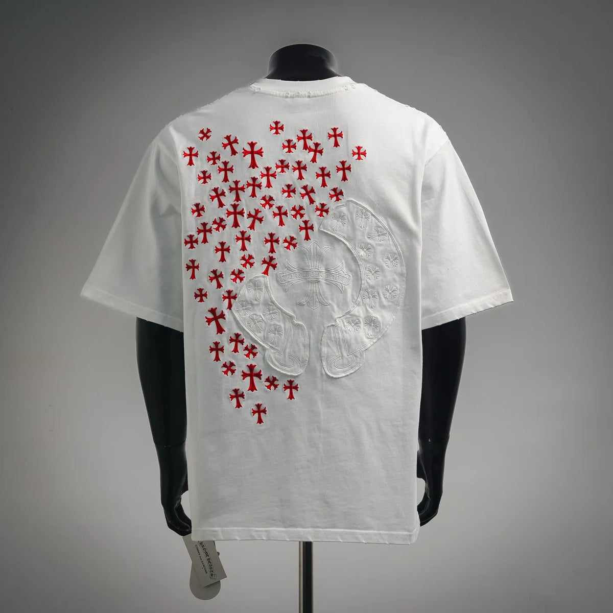 White T-shirt back with red cross pattern and embossed white graphic