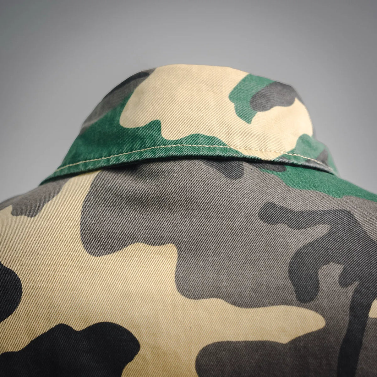 Camo shirt shoulder and upper back with stitched seam and soft brim