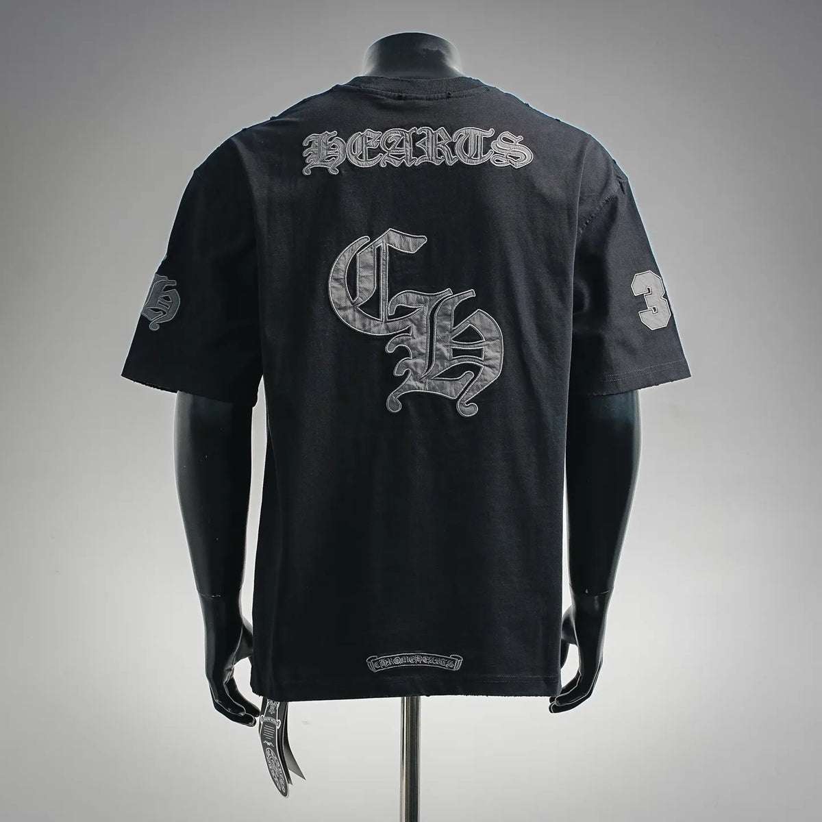 Black crewneck T-shirt with large back chrome-style graphic and lettering print