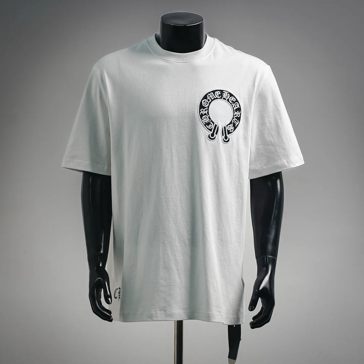 White short-sleeve T-shirt with circular black graphic logo on chest