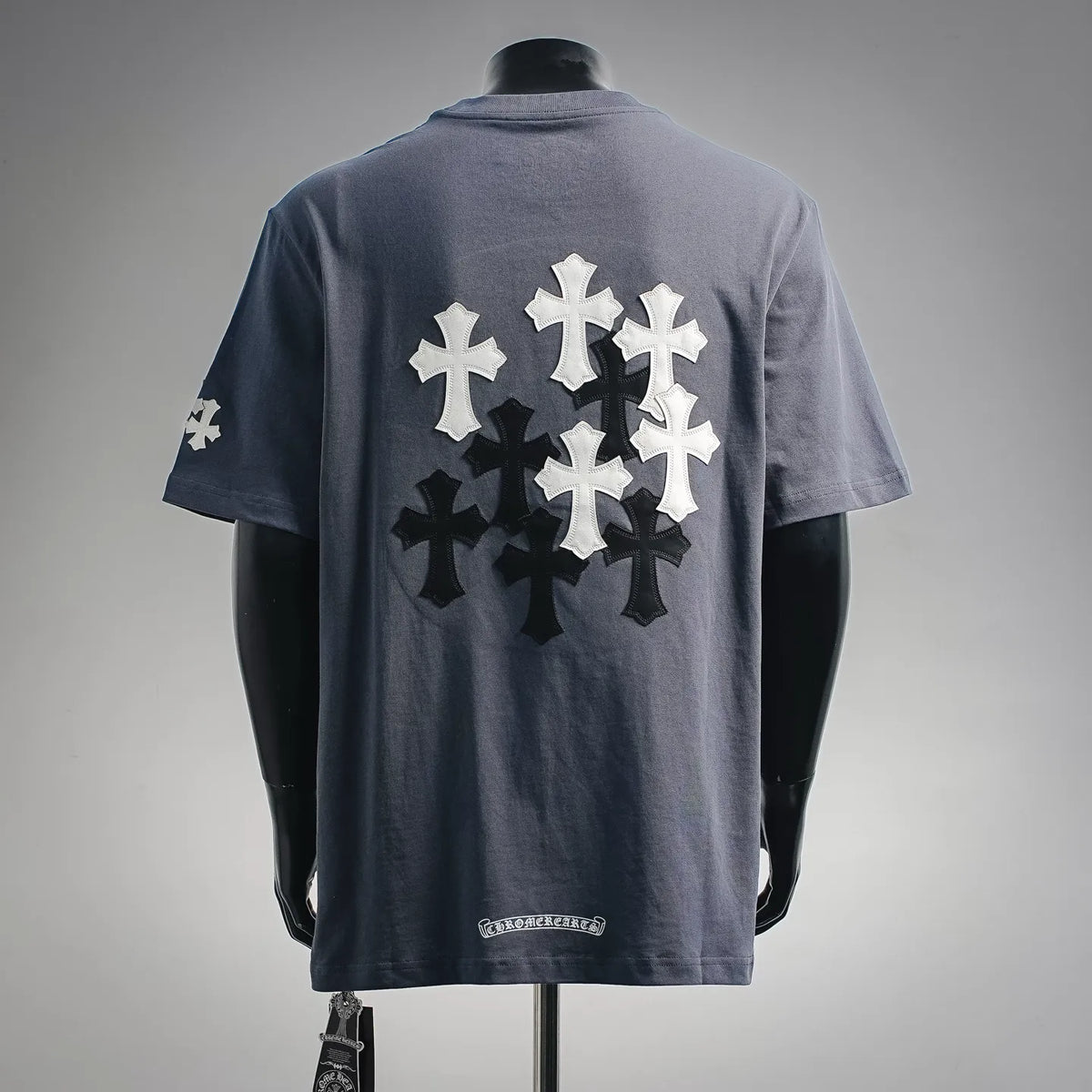 Navy blue graphic T-shirt back with large cross pattern and small side logo