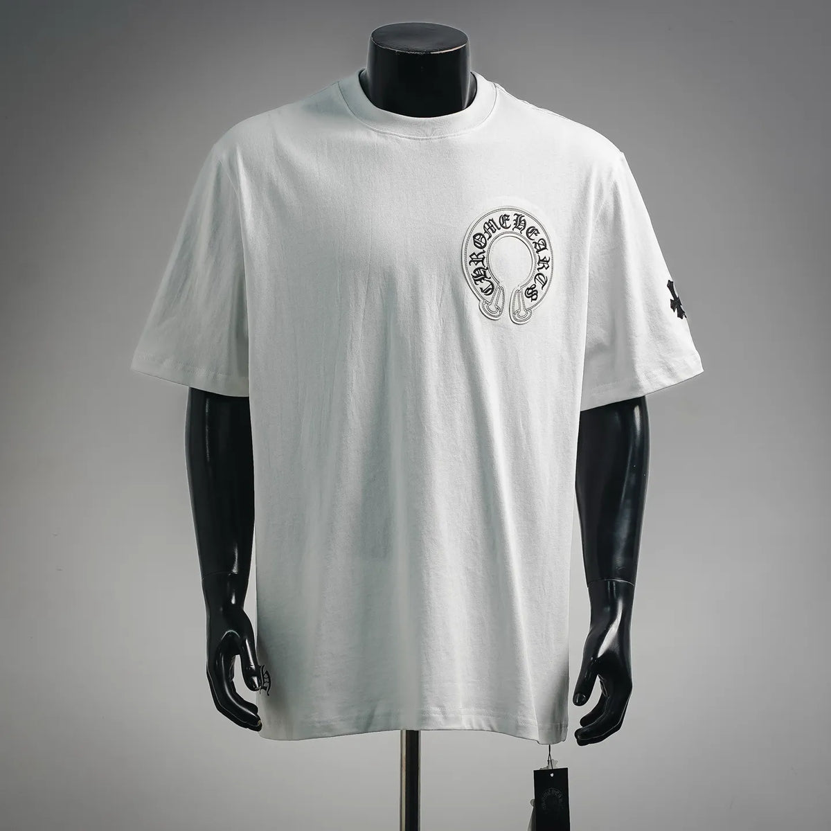 White short-sleeve T-shirt with chest circular logo patch