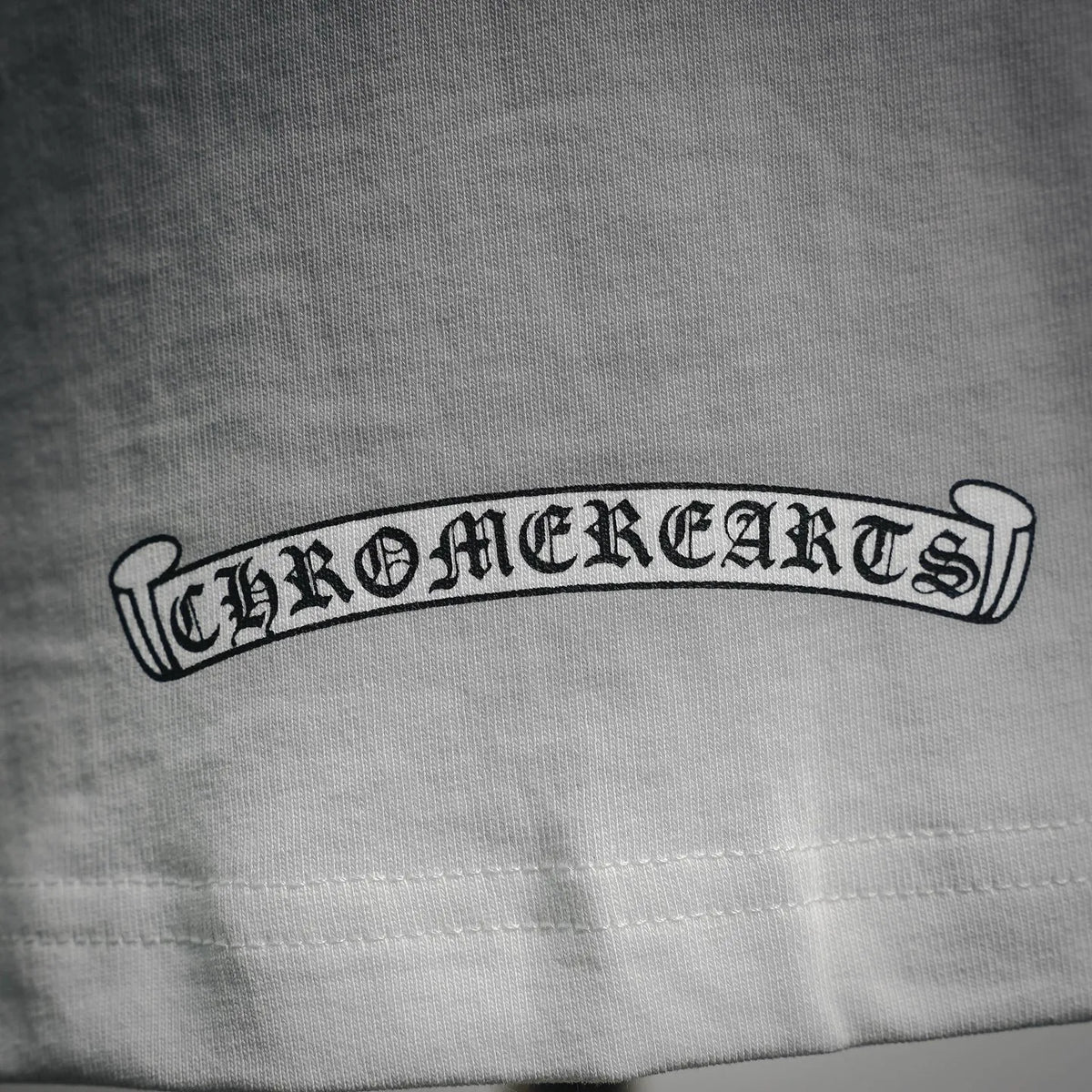 White T-shirt chest logo band embroidery detail