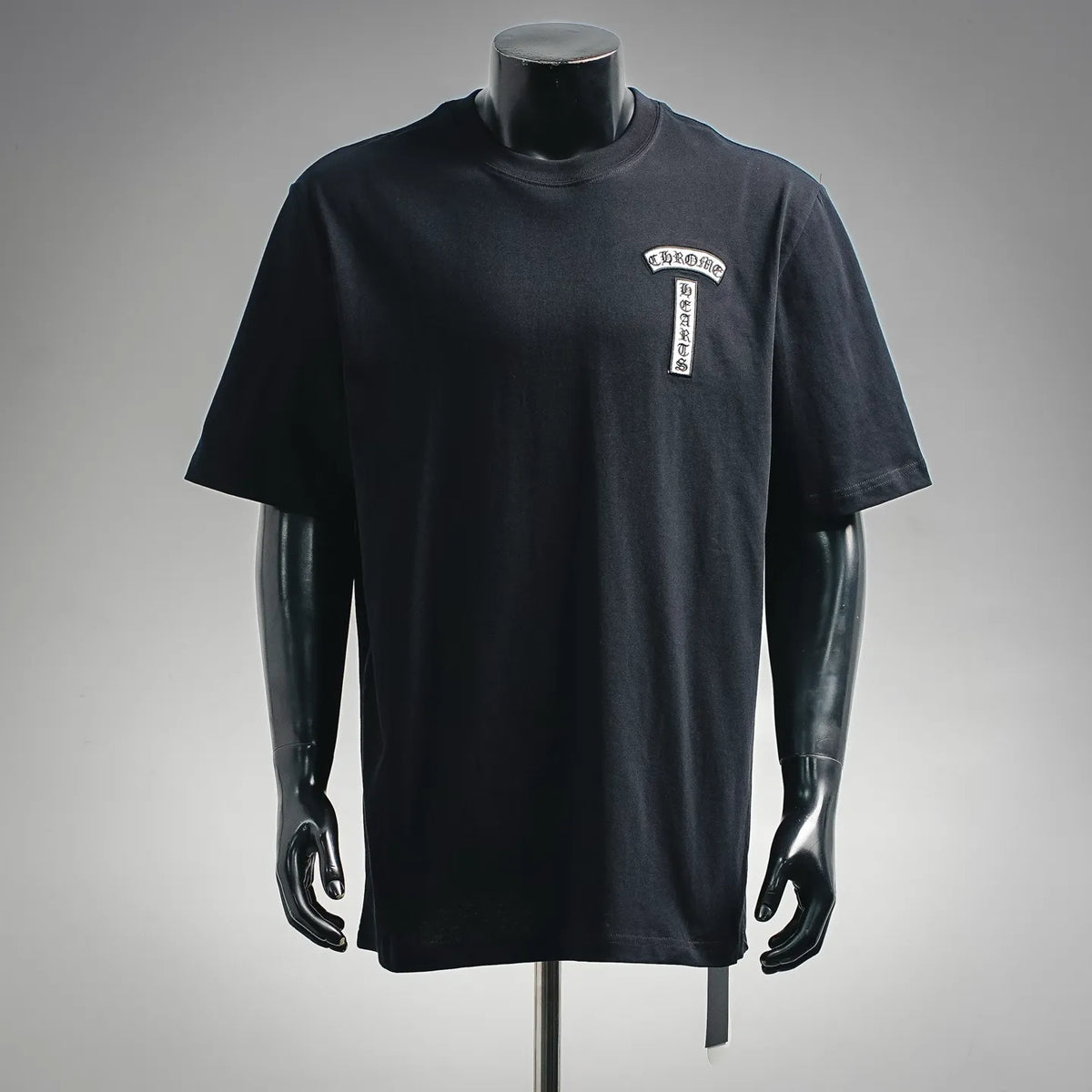 Black crewneck T-shirt with small chest logo patch