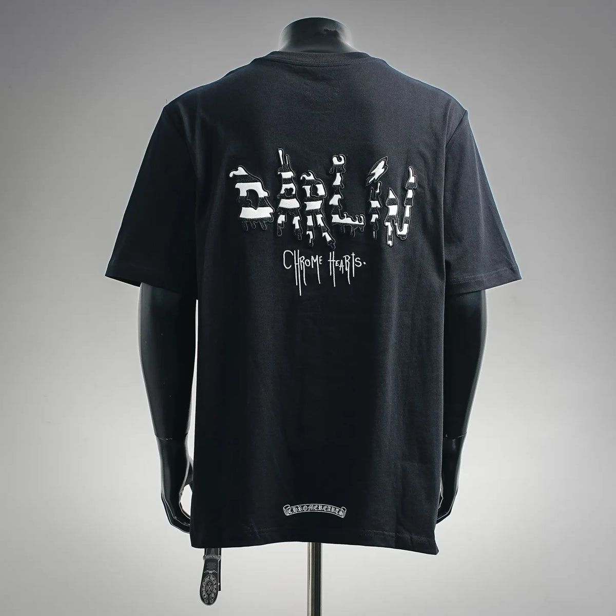 Black crewneck T-shirt with large back graphic and dripping “Chrome Hearts” text
