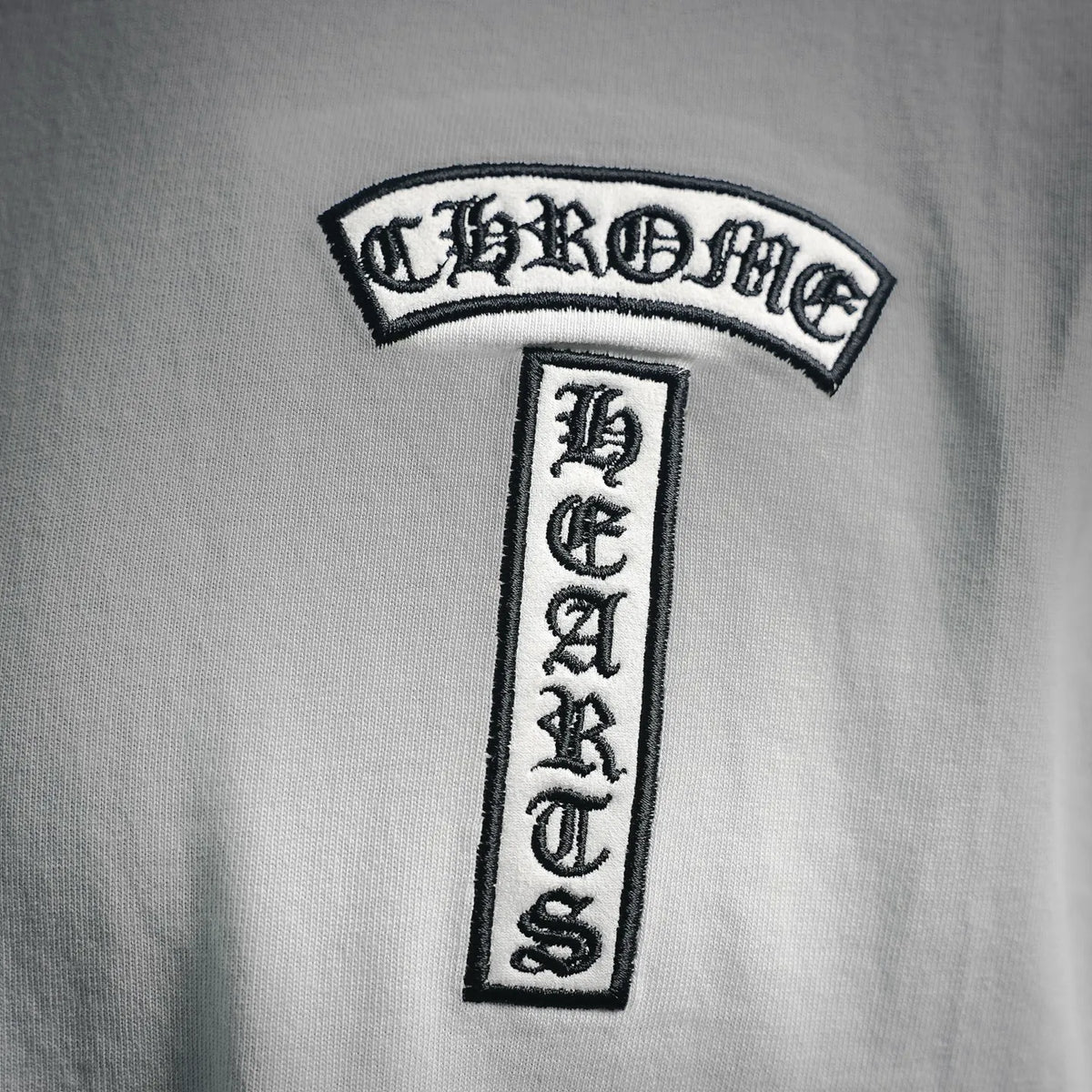 White T-shirt close-up of chest badge logo patch design
