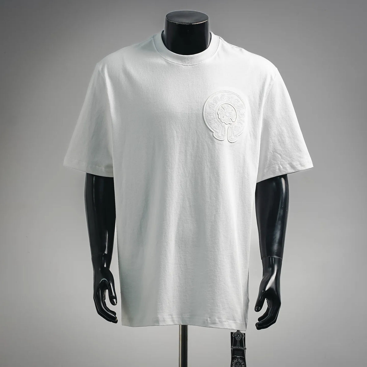 White short-sleeve crewneck T-shirt with raised chest logo applique