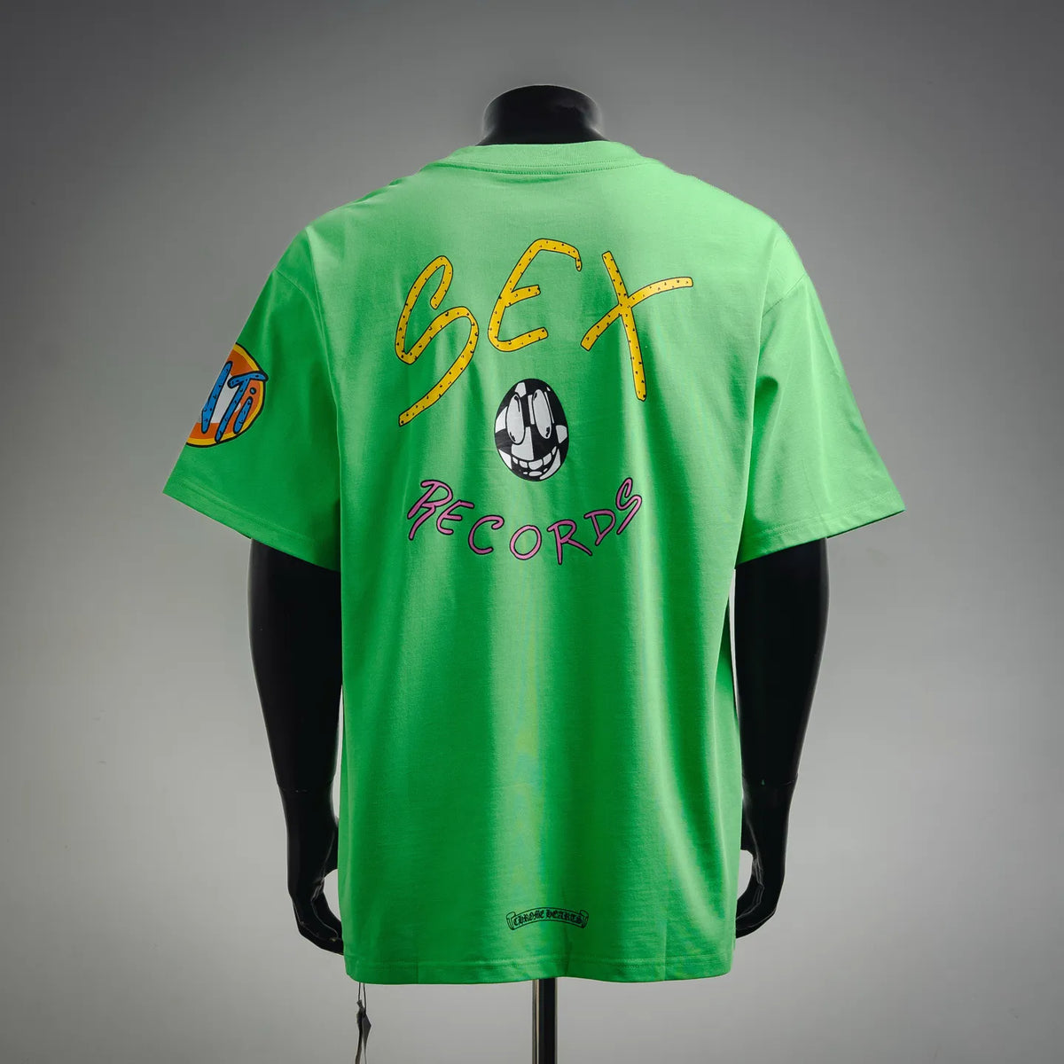 Green short-sleeve T-shirt, back view, large “Sex Records” graphic with skull