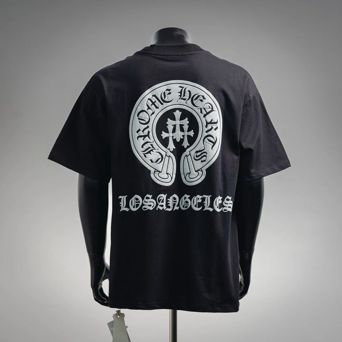 Black crewneck short-sleeve T-shirt with large white back crest graphic and text
