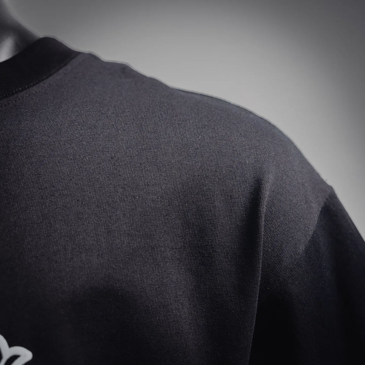 Black crewneck short-sleeve T-shirt fabric texture close-up