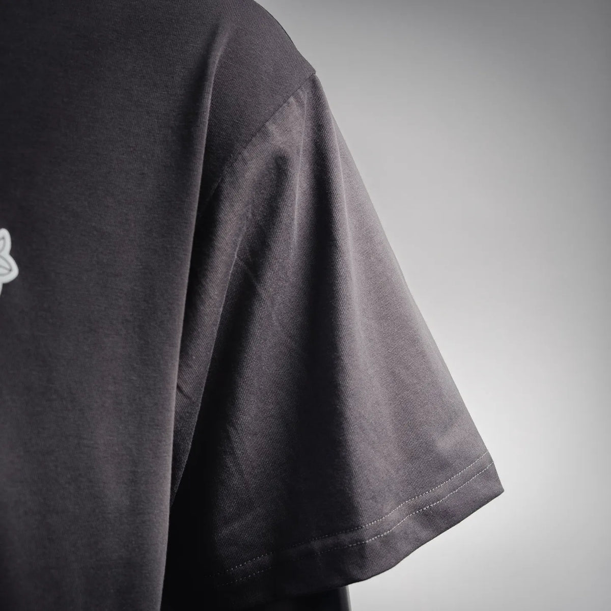 Charcoal short-sleeve T-shirt side view with clean hem and stitching