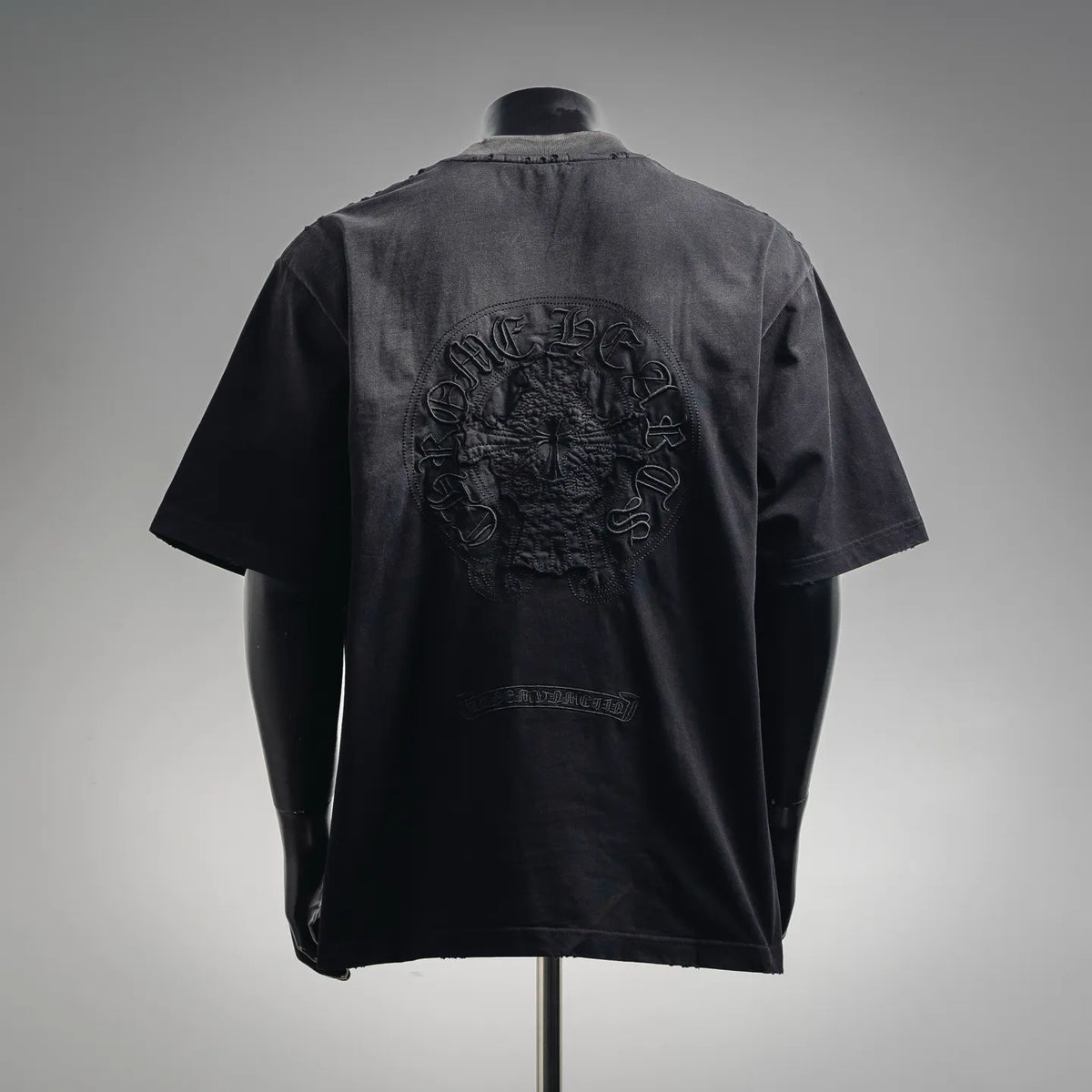 Black short-sleeve T-shirt with large embroidered crest on back