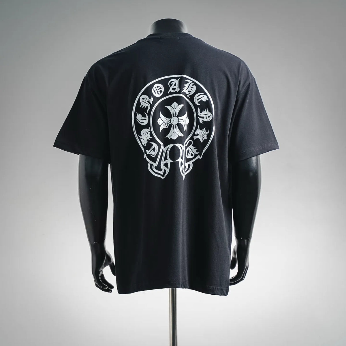 Black short-sleeve crewneck T-shirt with large white back skull graphic