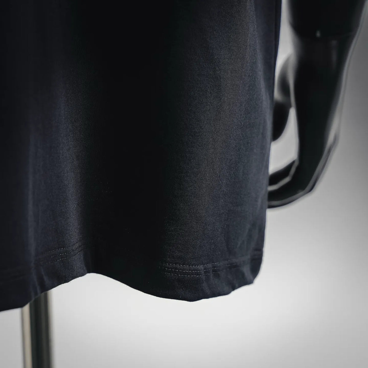 Black short-sleeve T-shirt hem with stitched edge