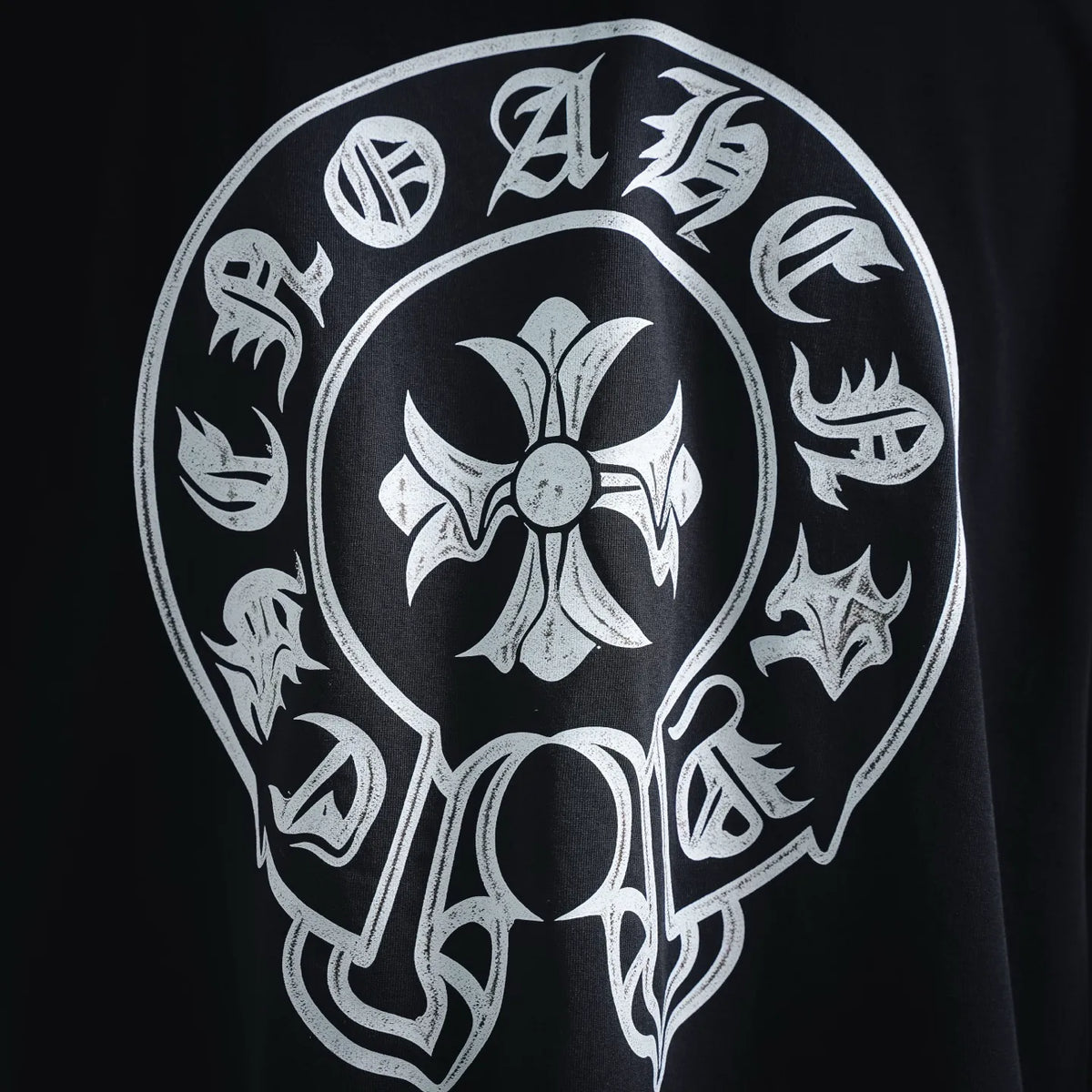 White skull and floral graphic print on black T-shirt back