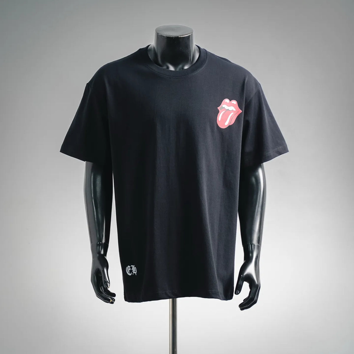 Black short-sleeve T-shirt with small pink and white lips logo at chest