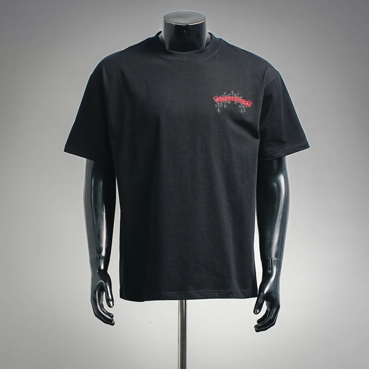 Black short-sleeve T-shirt with small red chest logo graphic