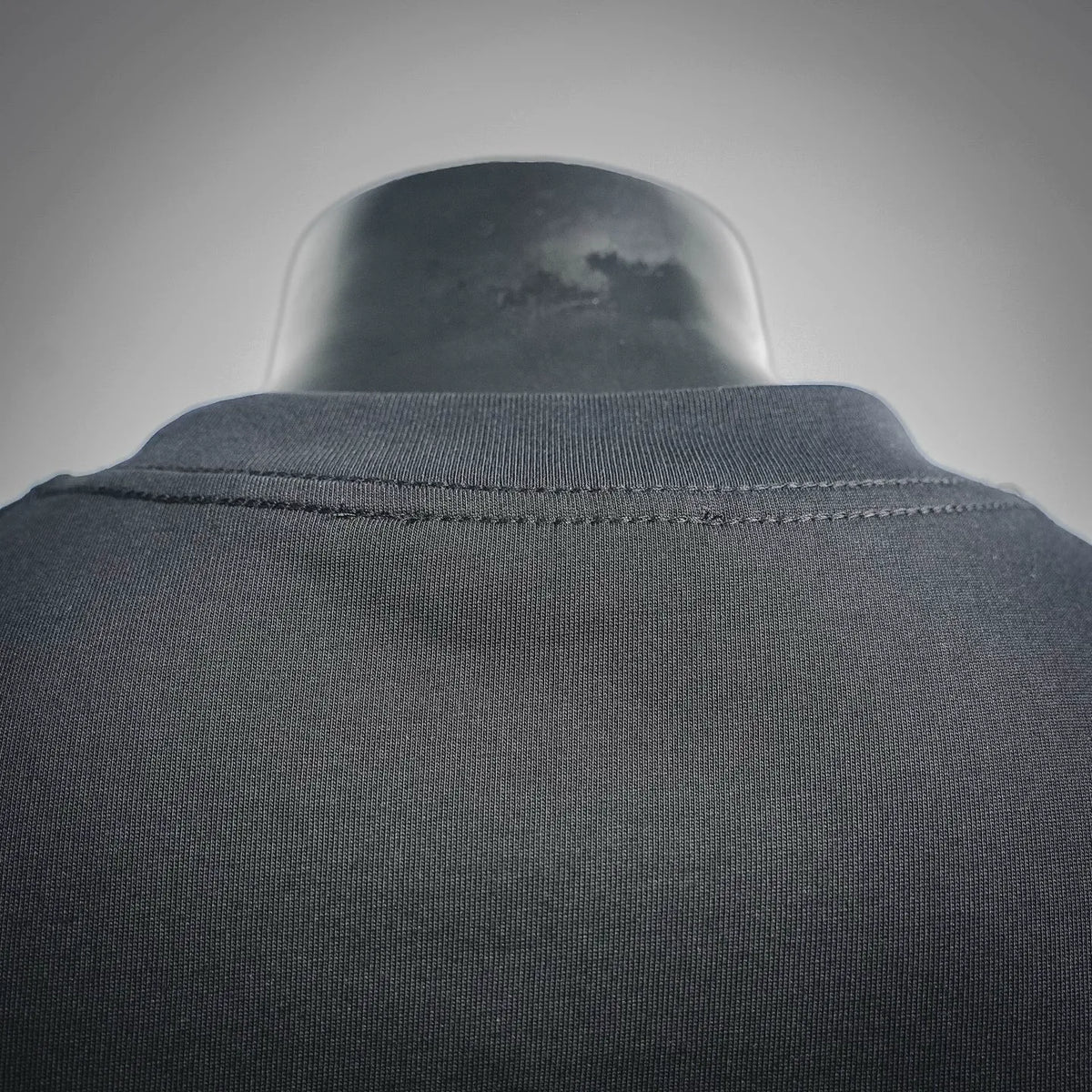 Black short-sleeve T-shirt collar and stitching detail