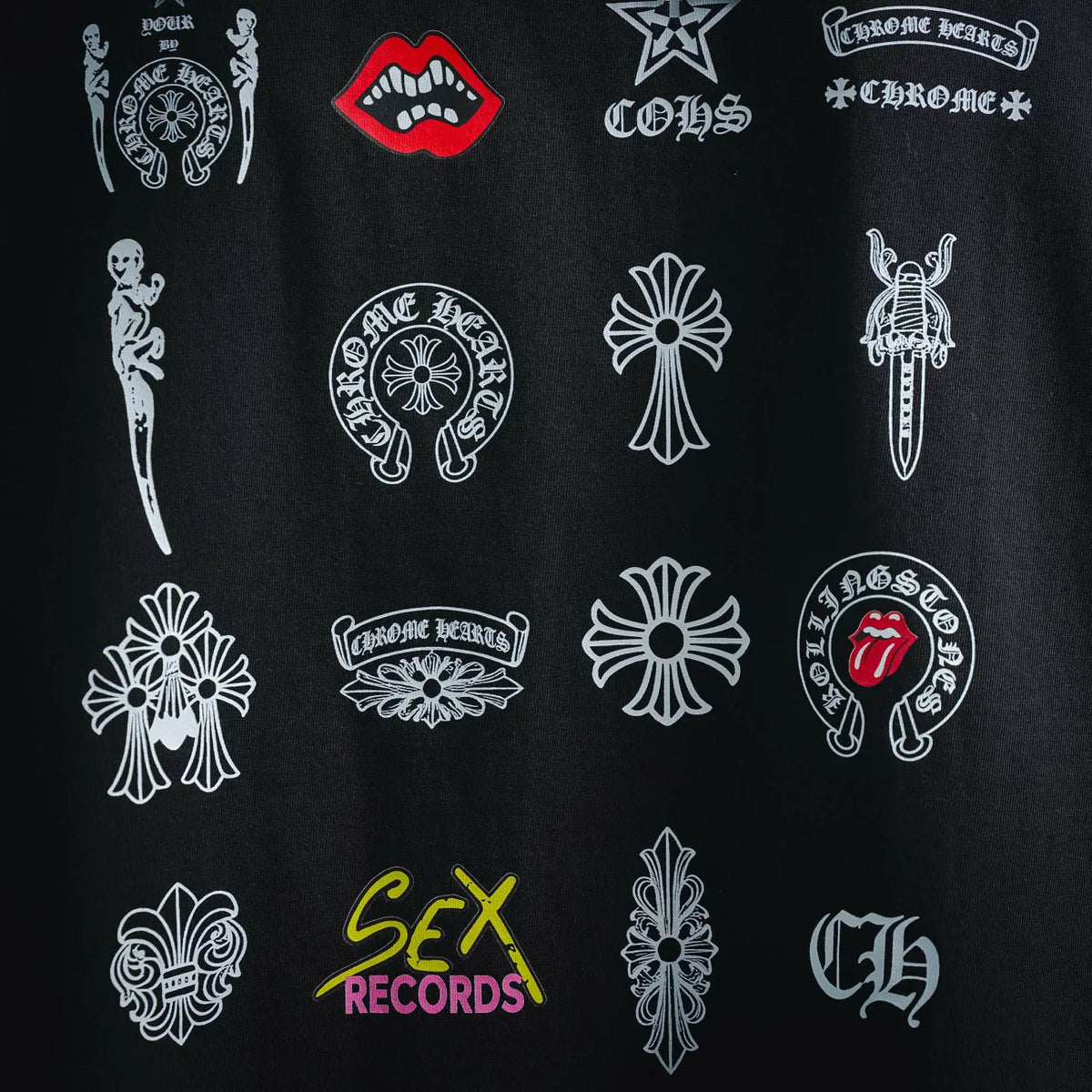 Black T-shirt with assorted white and red graphic icons, crew neck, short sleeves