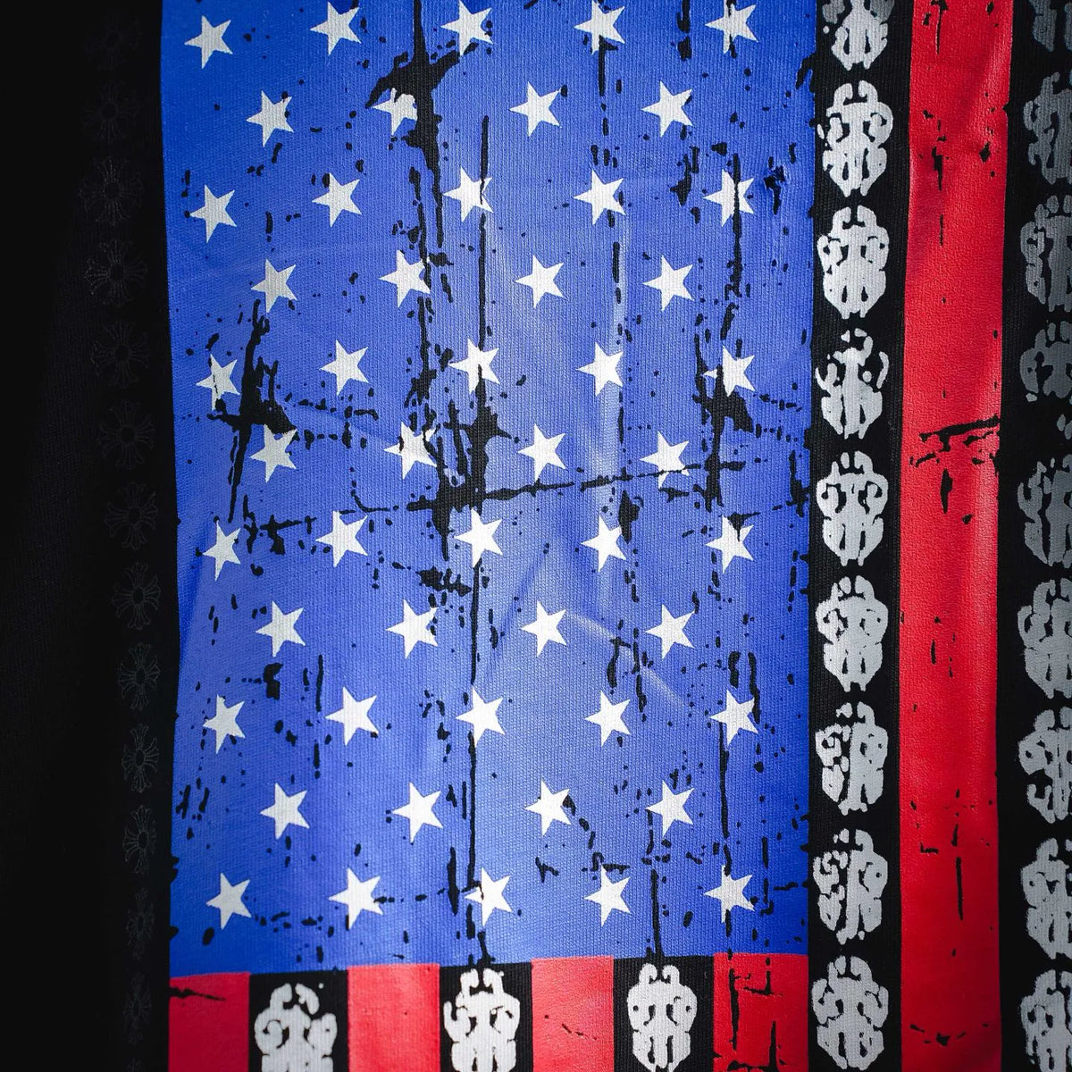 American flag print graphic on black T-shirt with blue stars and red stripes