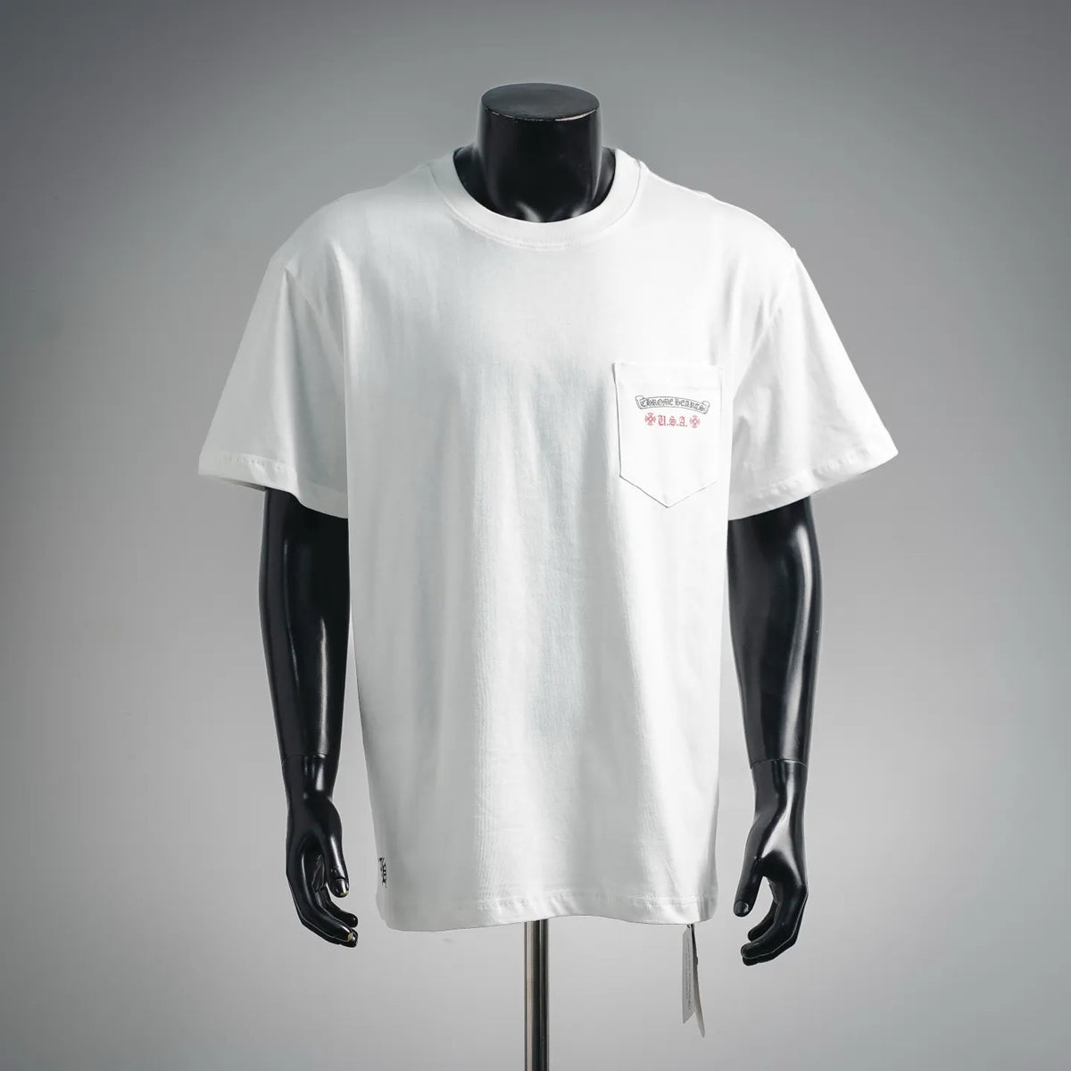 White short-sleeve graphic T-shirt with chest pocket and small colorful print