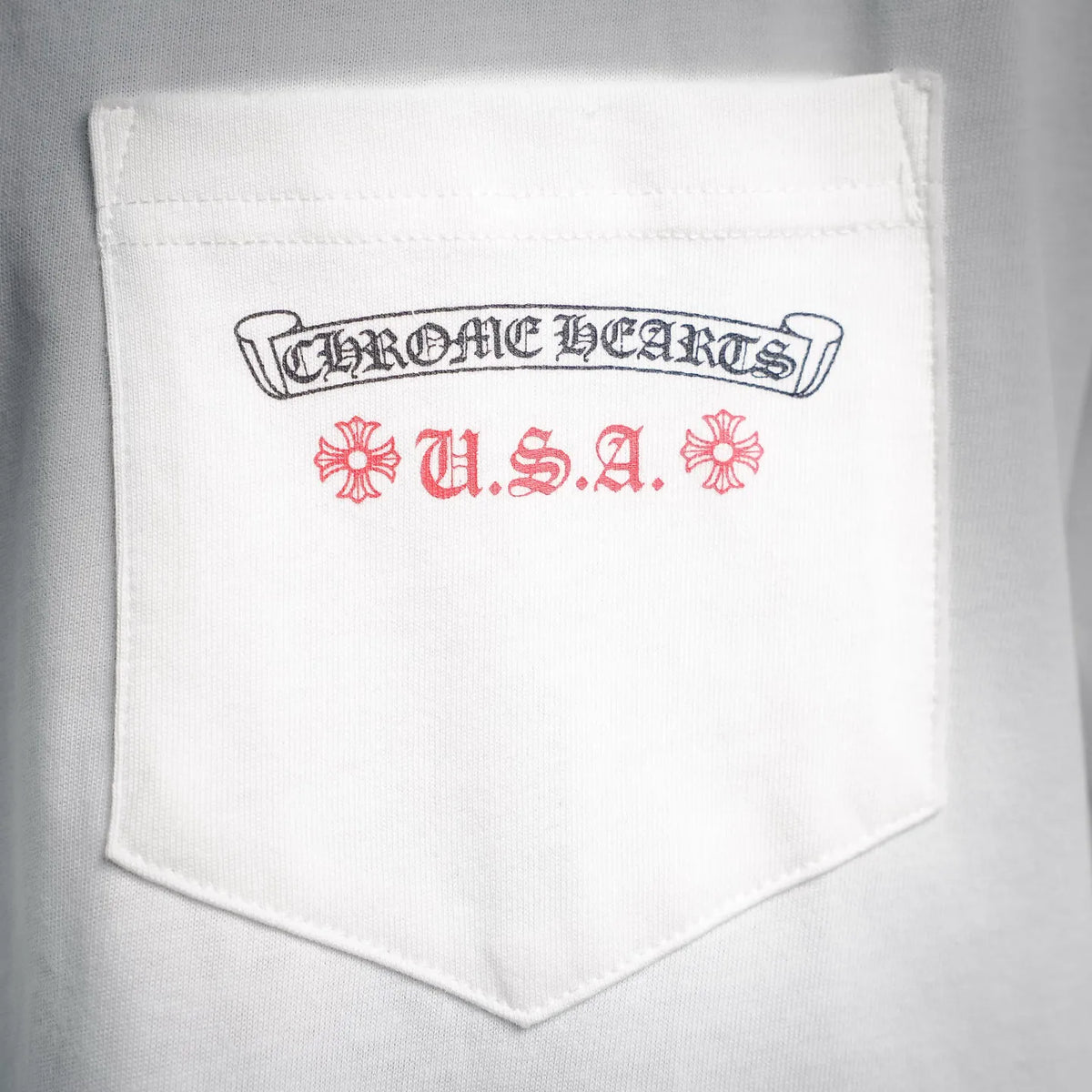 White chest pocket on T-shirt with Chrome Hearts U.S.A. label