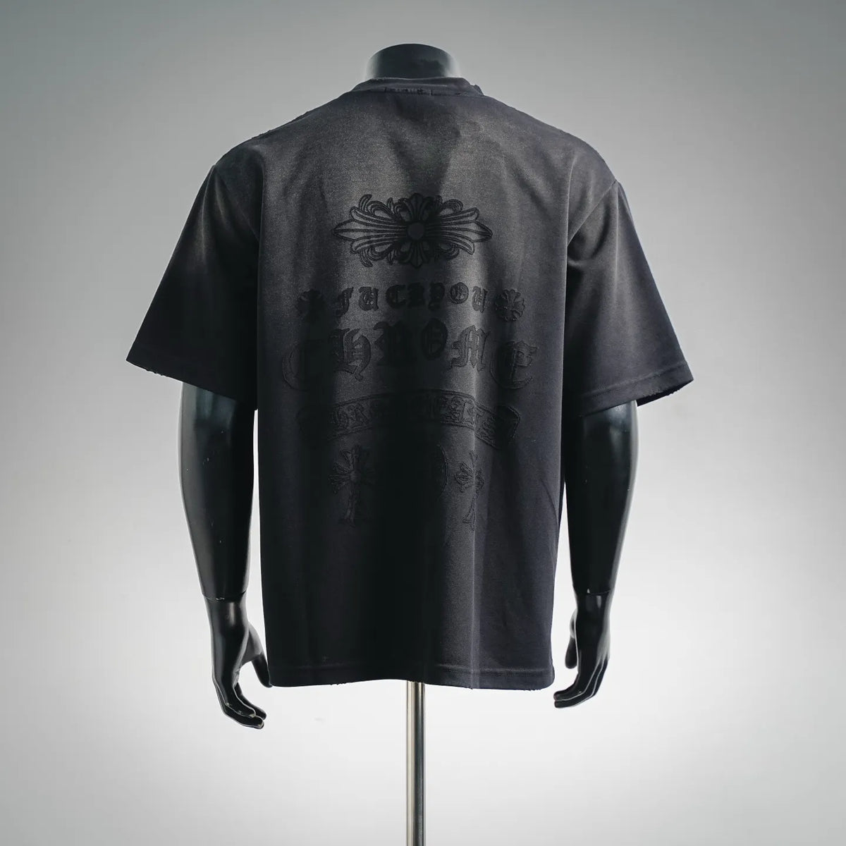 Black short-sleeve T-shirt with large back floral graphic and lettering, crew neck