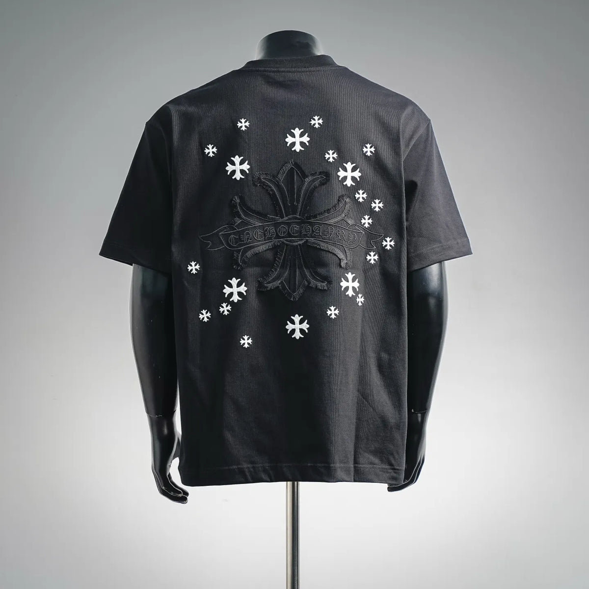 Black crew-neck T-shirt with large back graphic featuring crown and white snowflakes