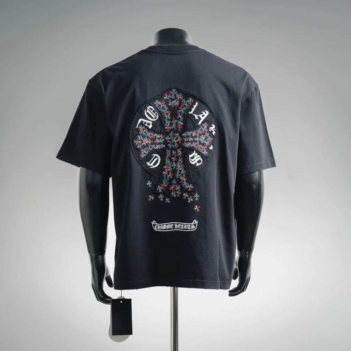 Black T-shirt with large back graphic cross patch and small logo label