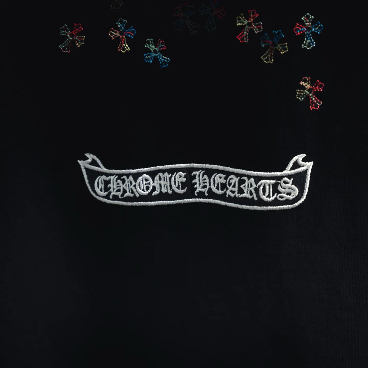 Black T-shirt chest logo banner with embroidered cross motif