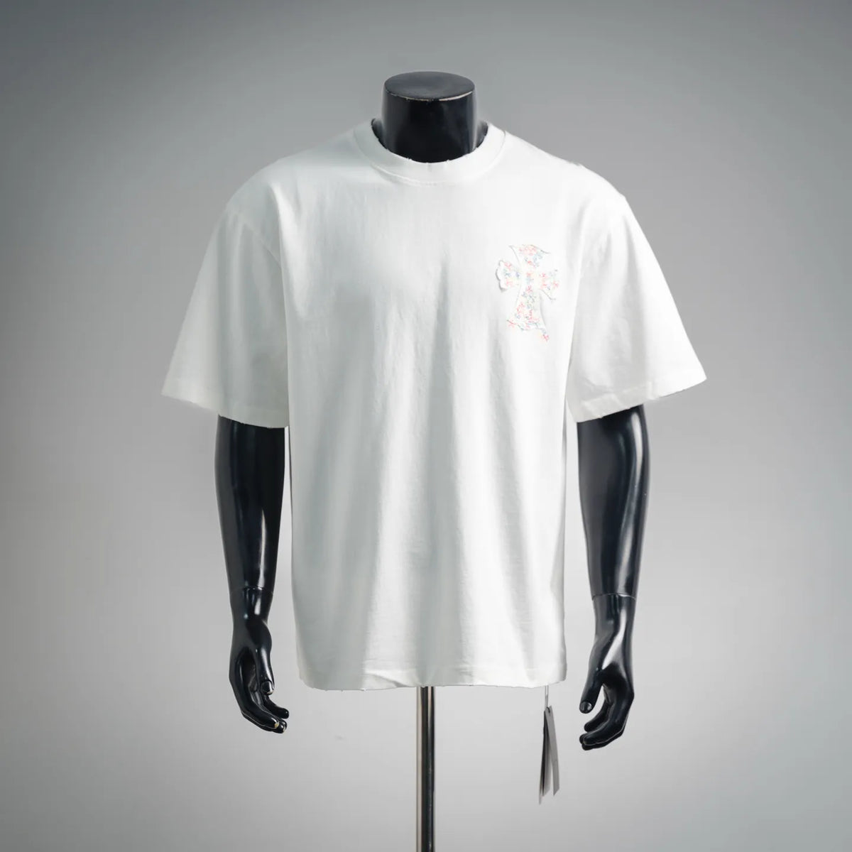 White short-sleeve T-shirt with small colorful embroidered chest logo