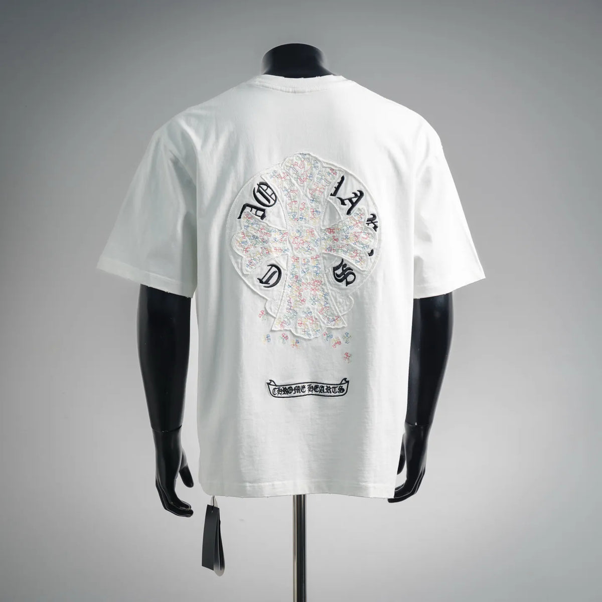 White short-sleeve T-shirt with large circular back embroidery graphic and text