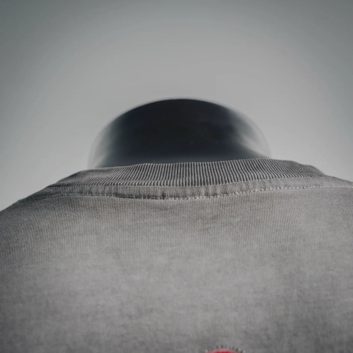 Gray crewneck T-shirt collar ribbed neckline on a mannequin