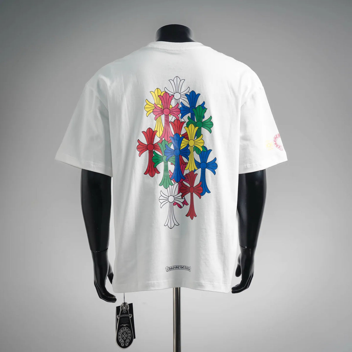 White short-sleeve T-shirt with large back bouquet graphic in multicolor flowers.