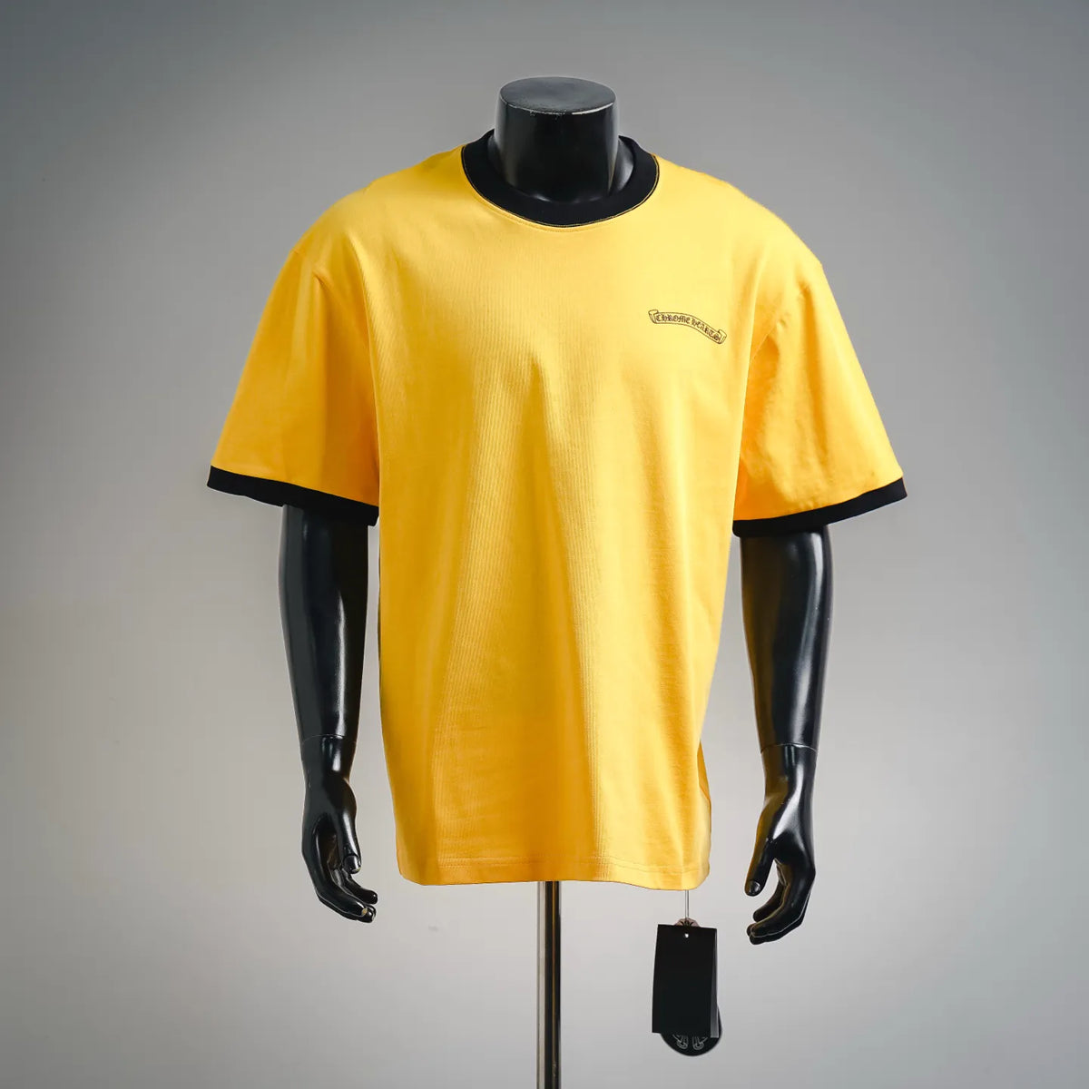 Yellow short-sleeve graphic T-shirt with black collar and sleeve trim