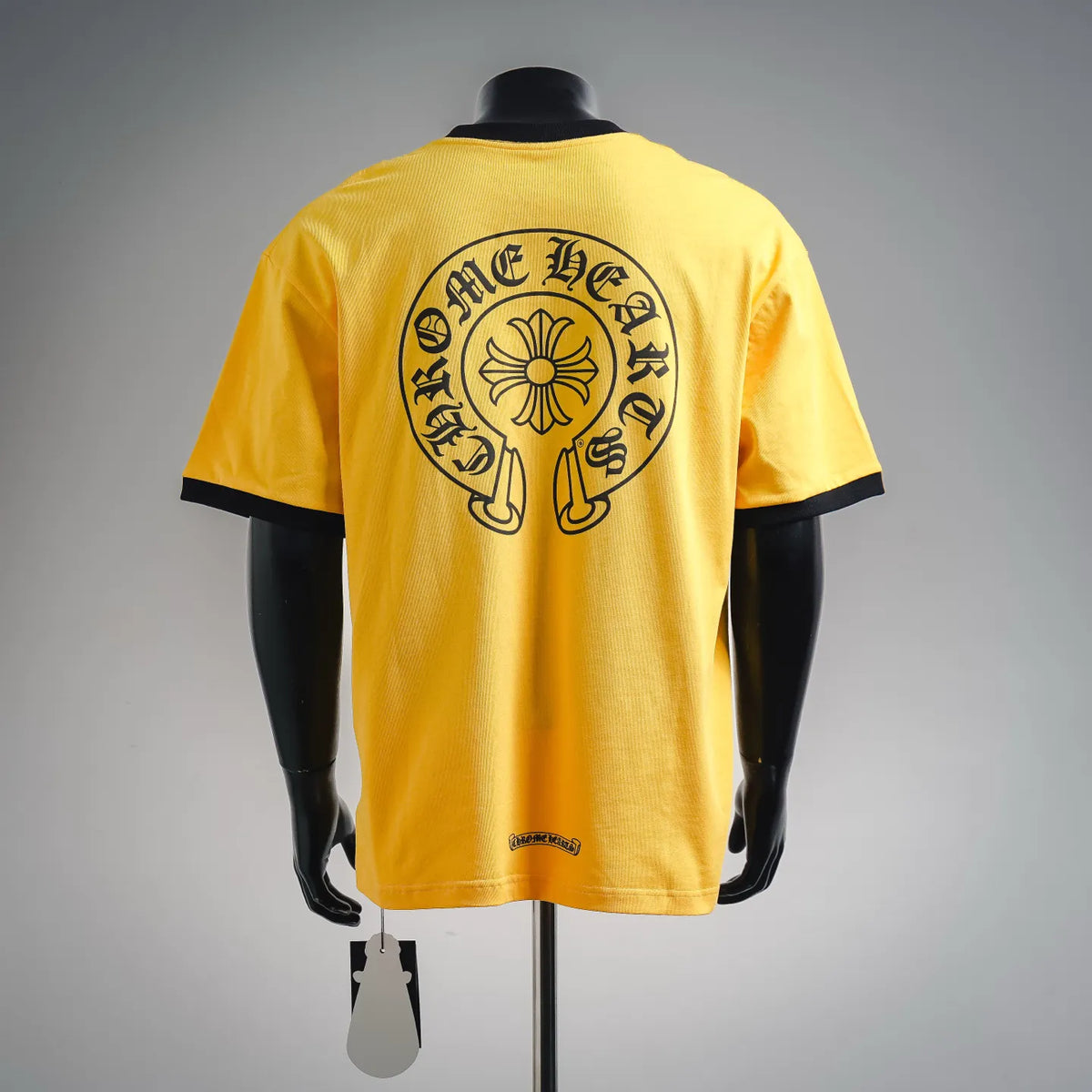 Yellow short-sleeve T-shirt with large back circular graphic and black trim