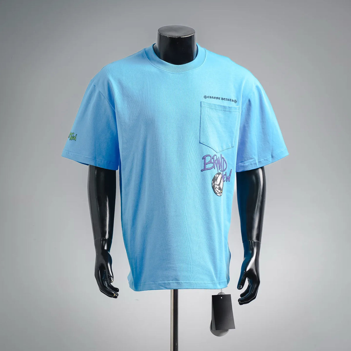 Light blue graphic short-sleeve T-shirt with chest pocket and small logo