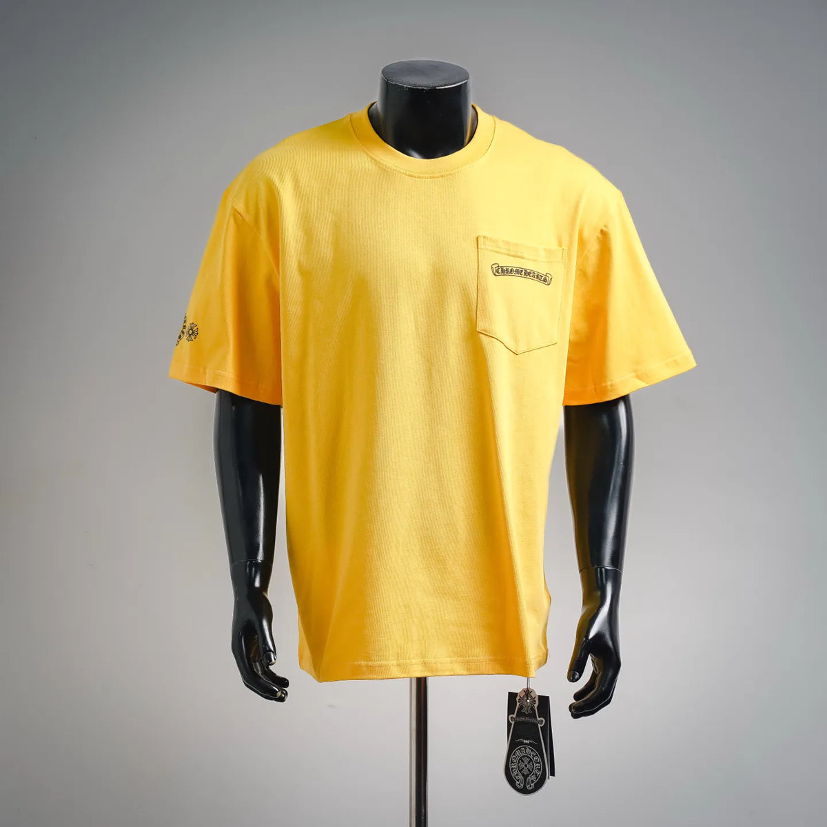 Yellow short-sleeve T-shirt with front chest pocket and small logo patch