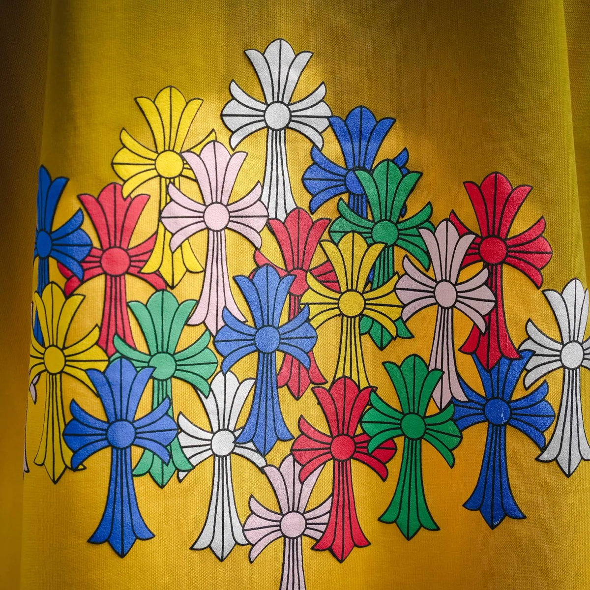 Colorful flower graphic on yellow short-sleeve T-shirt, front/back upper area