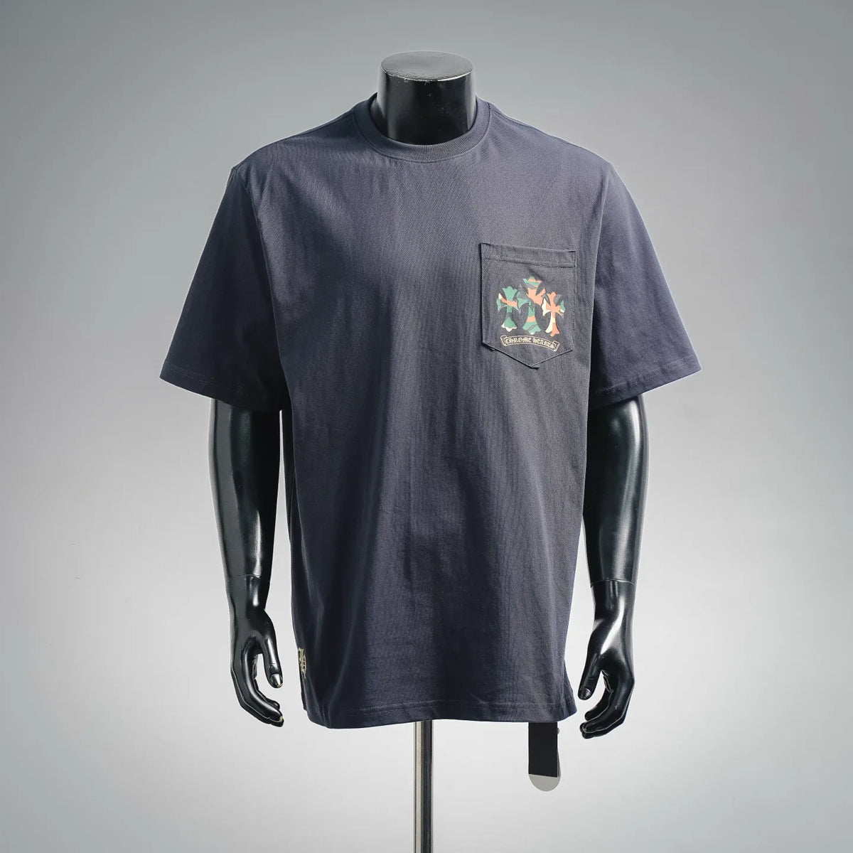 Dark navy short-sleeve T-shirt with small left-chest graphic on a pocket-style panel