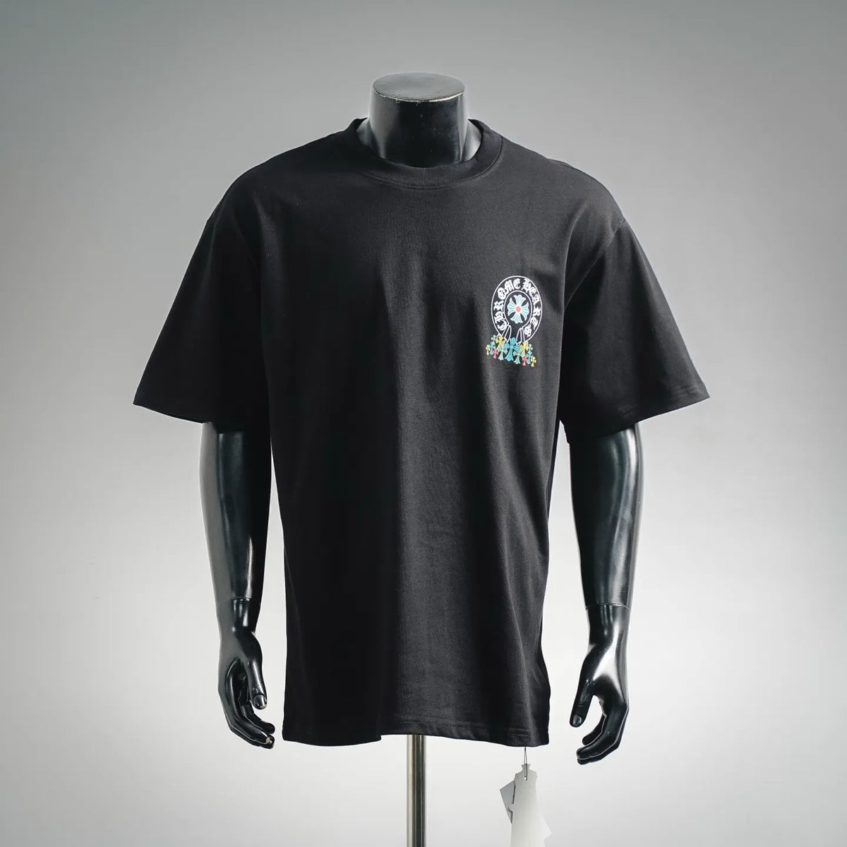 Black short-sleeve T-shirt with small chest graphic logo in white and colorful print