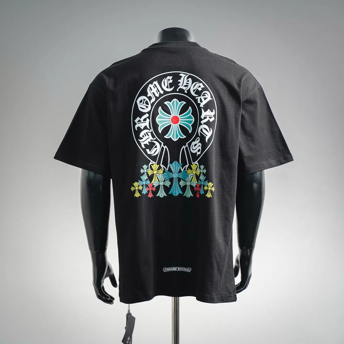 Black short-sleeve T-shirt with large back graphic featuring floral emblem and lettering
