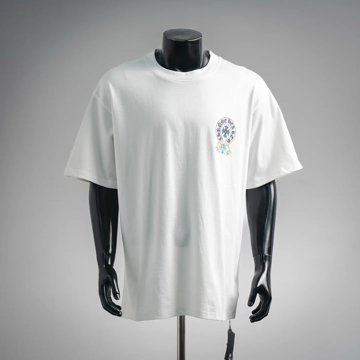 White crew-neck short-sleeve T-shirt with small front graphic print