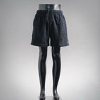 Textured dark navy elastic-waist shorts with drawstring, relaxed fit