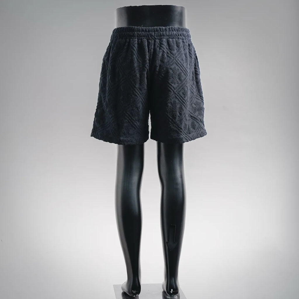Textured dark navy elastic-waist shorts with relaxed wide leg