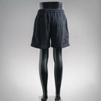 Textured dark navy elastic-waist shorts with relaxed wide leg