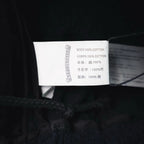 Inside shorts care label showing 100% cotton