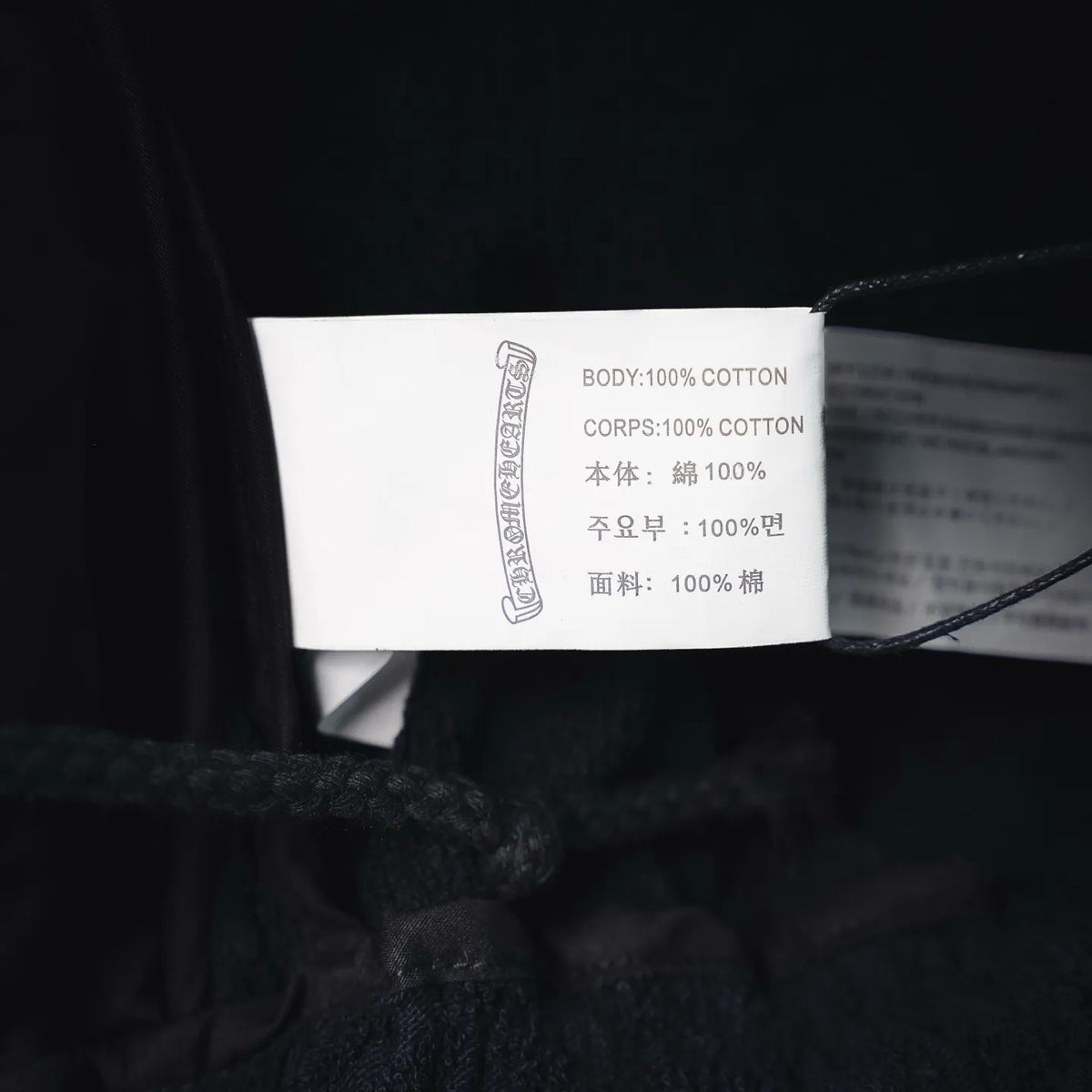 Inside shorts care label showing 100% cotton