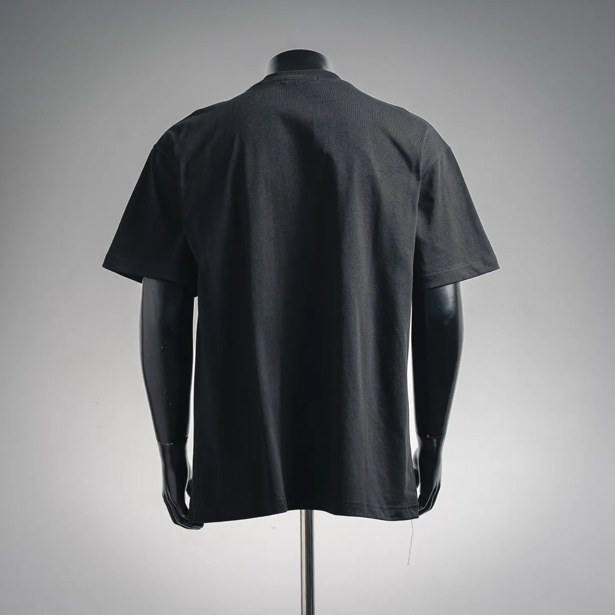 Black short-sleeve T-shirt back view, plain with no visible front print