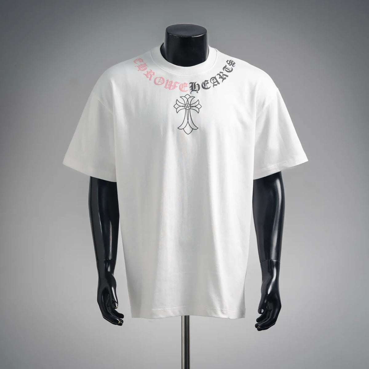 White crew-neck T-shirt with front cross and ornate lettering graphic